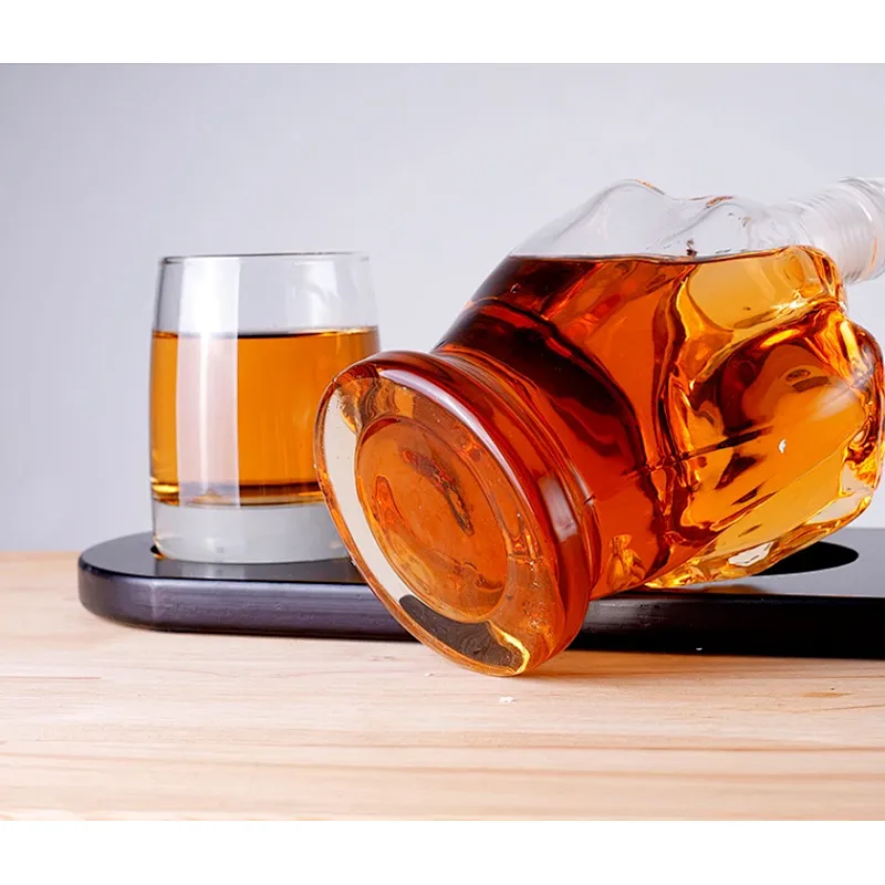 Thumb shaped whiskey bottle with high borosilicate material