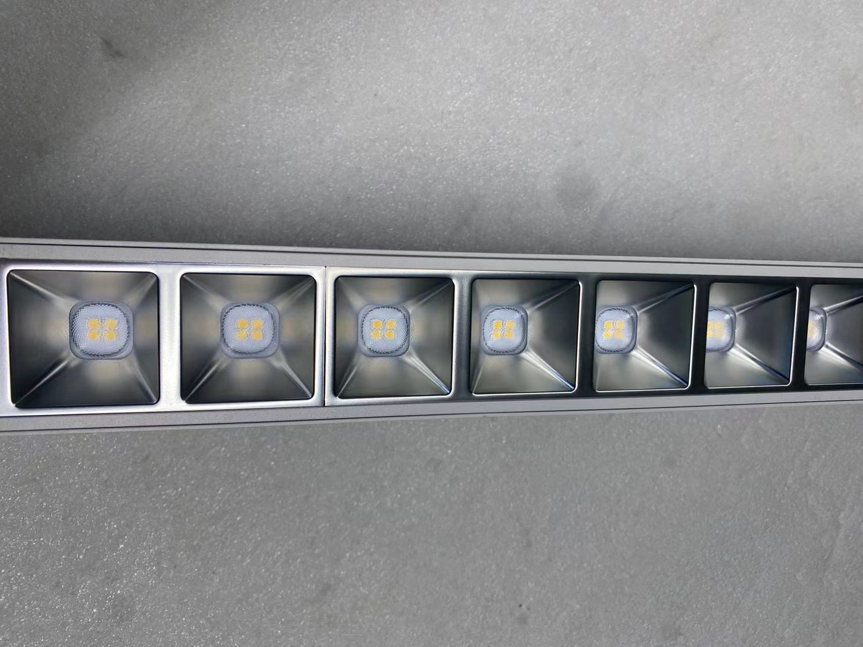 Lumin UltLine X2 linear light reflector cup close up showing optical design for UGR16