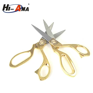 Golden scissors for cutting fabric