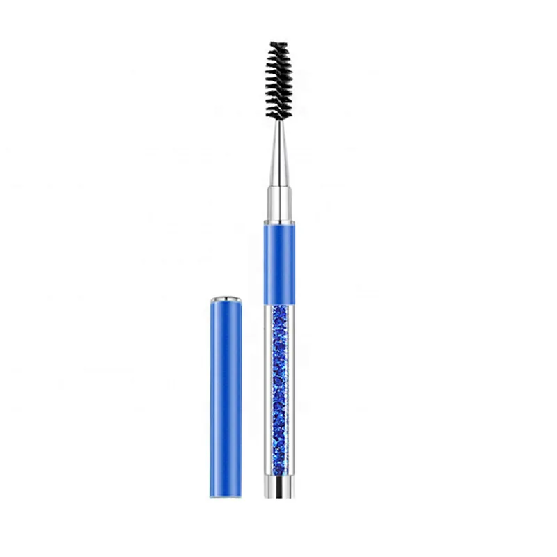 A makeup brush with a diamond handle and cap for brushing eyelashes