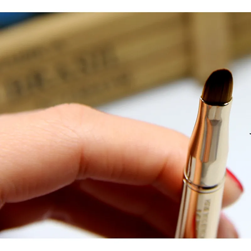 Dual use retractable lip brush angled eyebrow brush