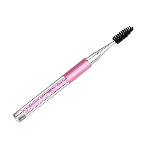 A makeup brush with a diamond handle and cap for brushing eyelashes