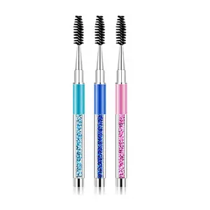 A makeup brush with a diamond handle and cap for brushing eyelashes