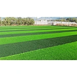 What is the advantage of non-infill artificial turf in soccer grass