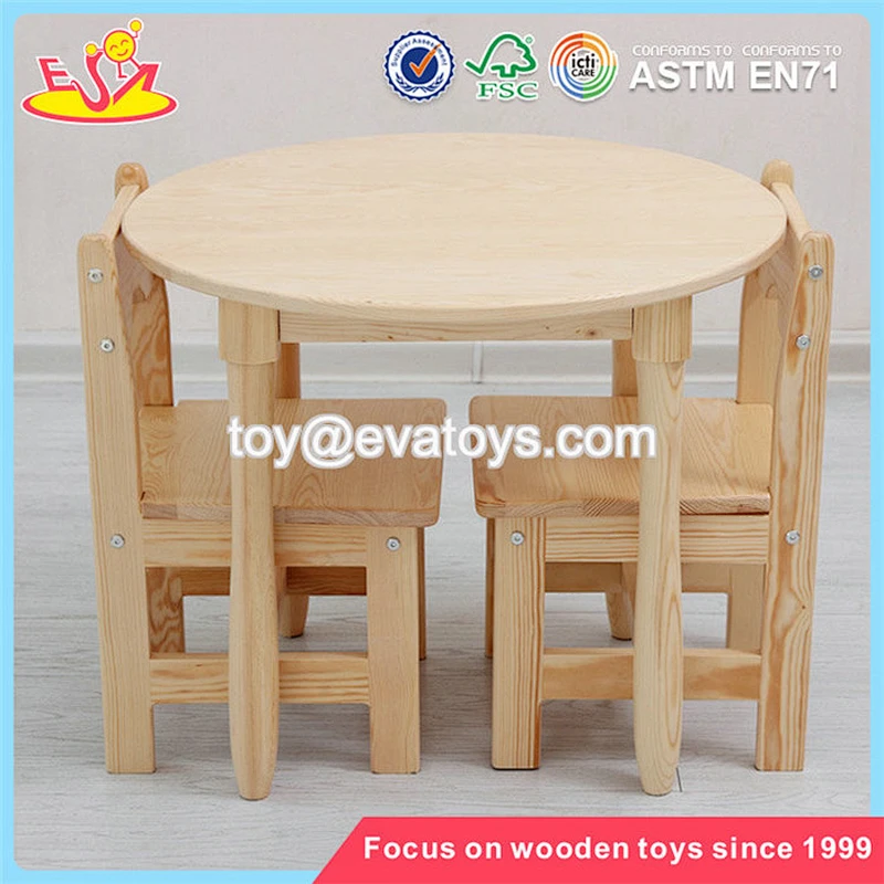 Wholesale simple style kids wooden round table and 4 chairs used in home and school W08G232