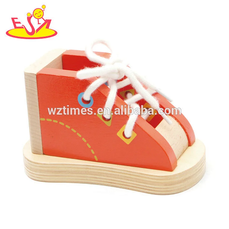 Neues heißes pädagogisches hölzernes Schnürungsschuhspielzeug für das Unterrichten der Kinder, Schuhe W11E069 zu binden
