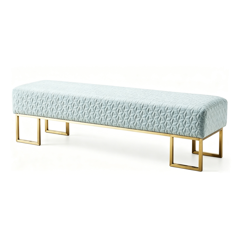 A modern bench featuring a blue geometric-patterned cushion and a gold metal frame