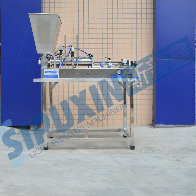 liquid filler with hopper and table