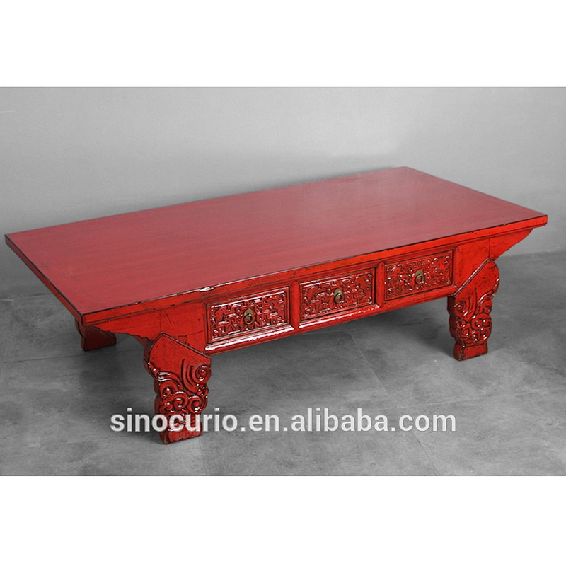 Antique carved coffee table with drawers