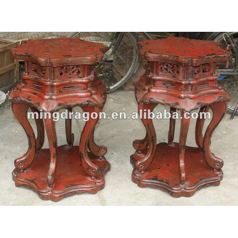 red wooden flower stool