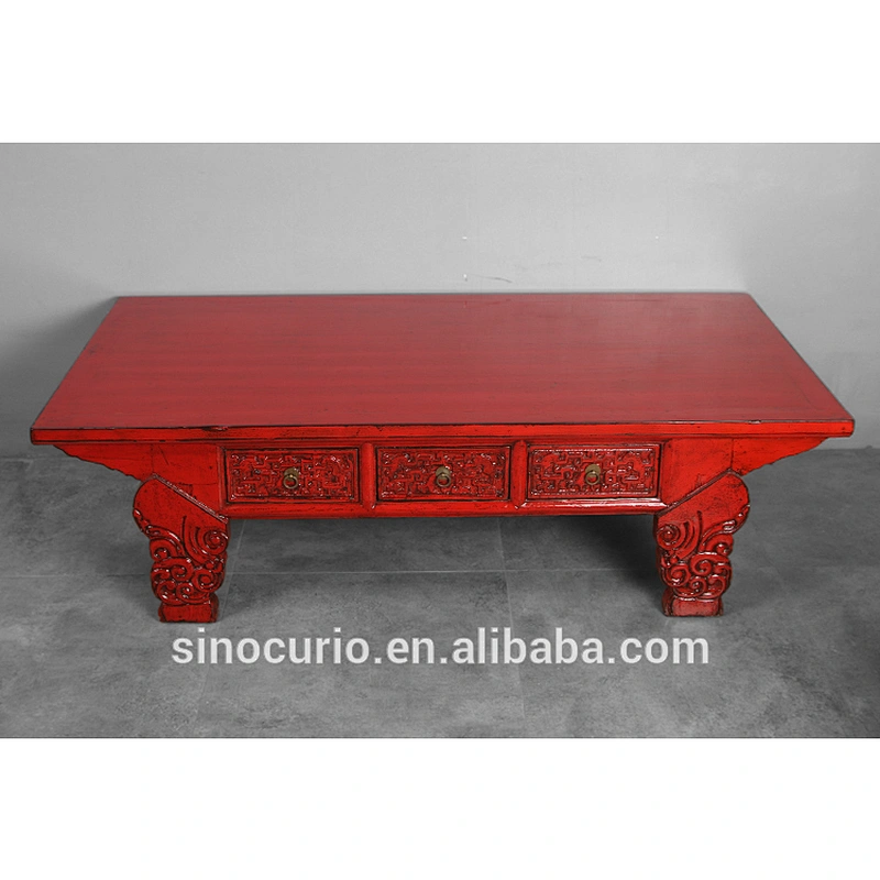 Antique carved coffee table with drawers
