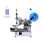 Manual flat surface labeling machine for engine oil bottle