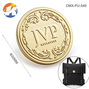Round With Embossed Logo Brush Bronze Handbag Metal Logo Designs