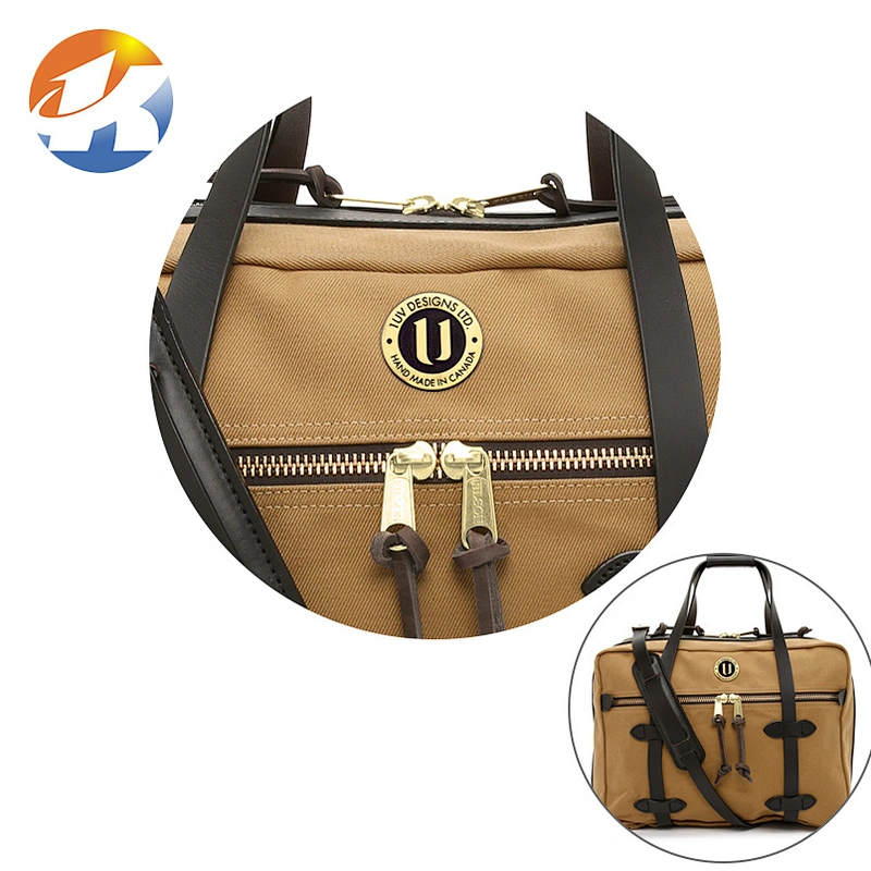 Round With Embossed Logo Brush Bronze Handbag Metal Logo Designs