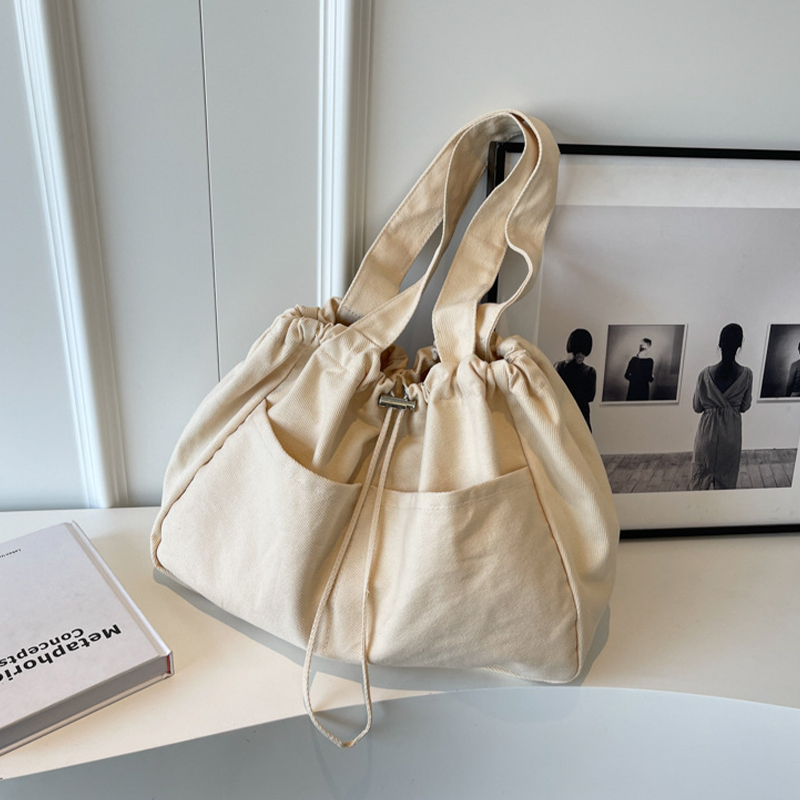 Explore the unique design features of drawstring tote bag, their versatile uses, and how XINHUI offers customizable options.