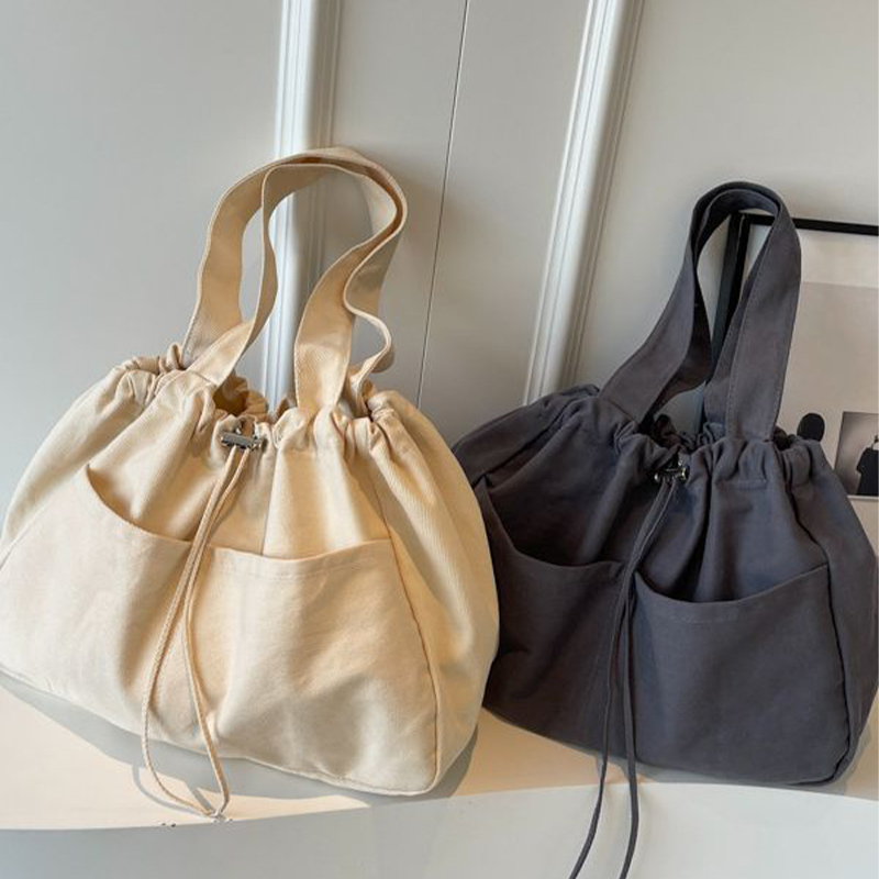 Explore the unique design features of drawstring tote bag, their versatile uses, and how XINHUI offers customizable options.
