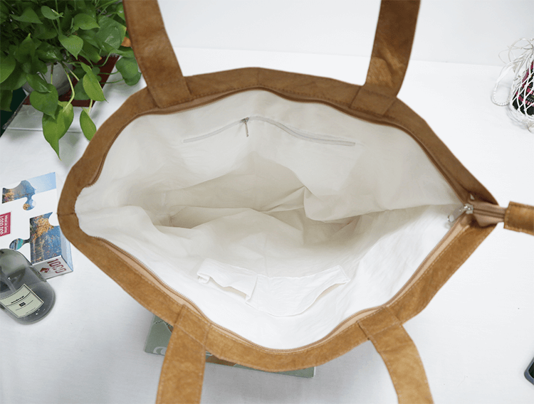 Explore the unique design features of tyvek tote bag, their versatile uses, and how XINHUI offers customizable options.
