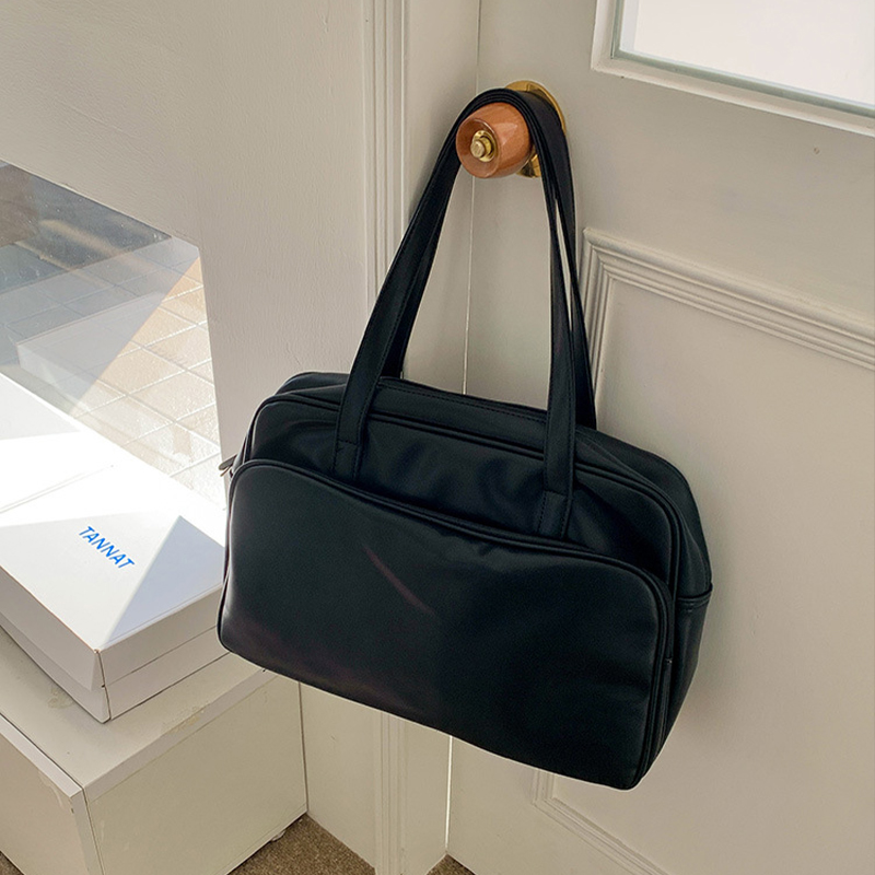 Explore the unique design features of black faux leather tote bag, their versatile uses, and how XINHUI offers customizable options.