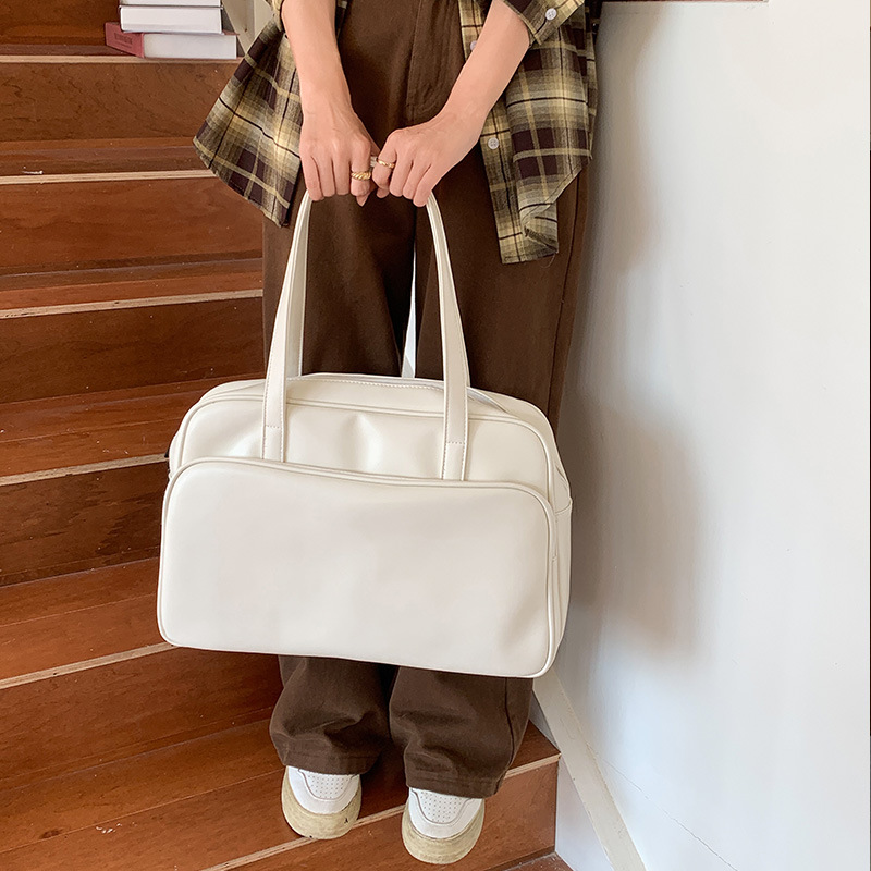 Explore the unique design features of black faux leather tote bag, their versatile uses, and how XINHUI offers customizable options.