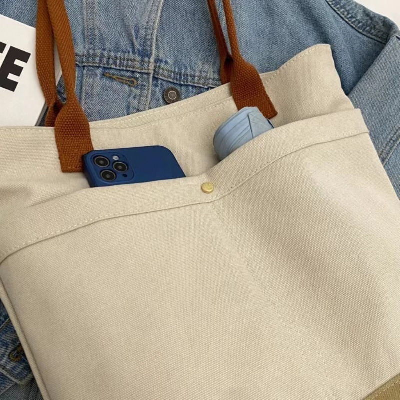 Explore the chic design features of canvas tote beach bags, their suitability for beach outings