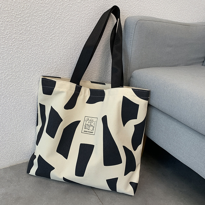 Explore the unique design features of canvas beach tote bags, their versatile uses, and how XINHUI offers customizable options.