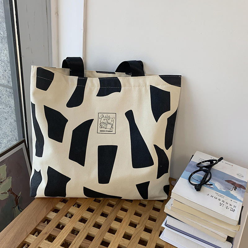 Explore the unique design features of canvas beach tote bags, their versatile uses, and how XINHUI offers customizable options.