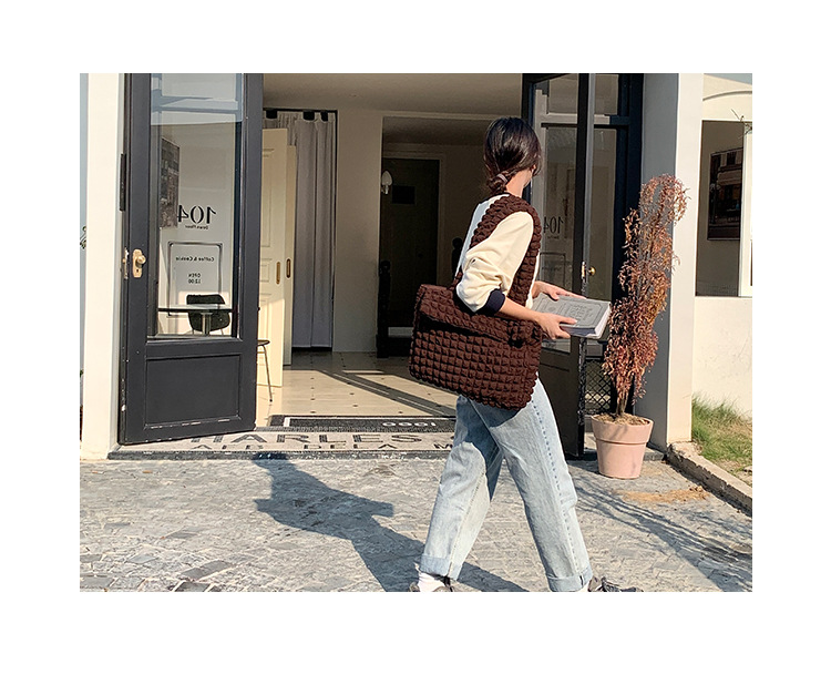 A cute Puffy Tote Bag made with soft filling materials and stylish design. It offers a comfortable feel and spacious storage, making it perfect for shopping, outings, and travel.