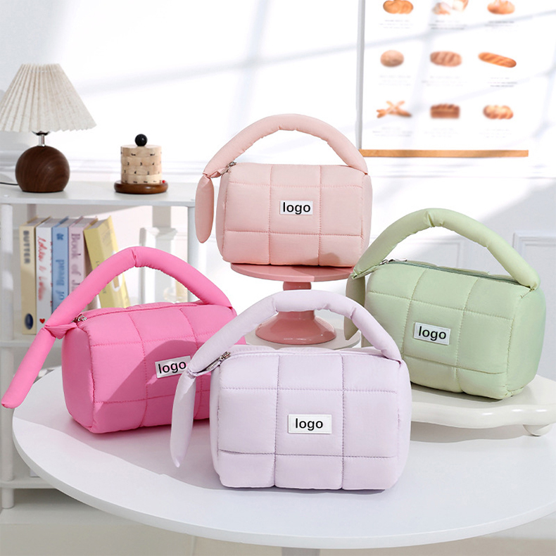 A compact and stylish **small makeup bag** with multiple compartments for organizing beauty essentials. Made from durable, waterproof material, this bag is perfect for travel or daily use, offering easy access with a smooth zipper and a sleek design that fits easily into any purse or luggage.