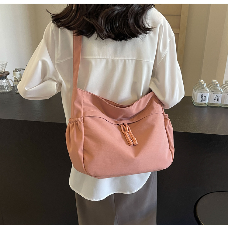 Explore the unique design features of canvas crossbody tote bag, their versatile uses, and how XINHUI offers customizable options.
