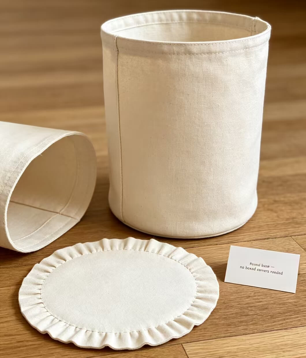 Round base bucket bag design as a practical alternative to traditional boxed corners.