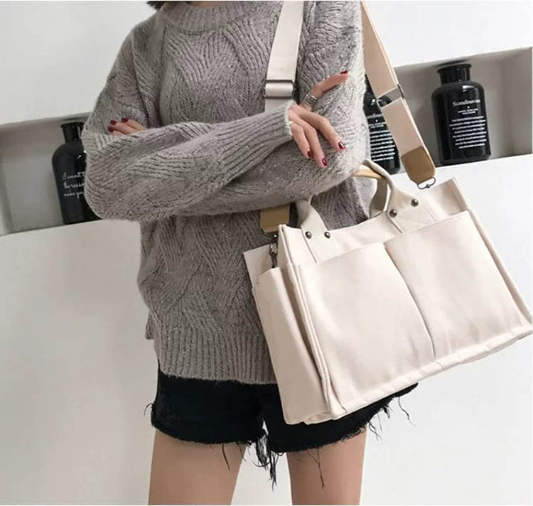 Explore the unique design features of large canvas tote with pockets, their versatile uses, and how XINHUI offers customizable options.