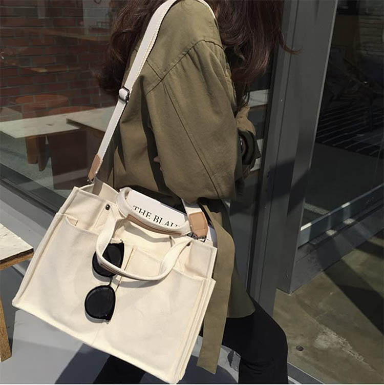Explore the unique design features of large canvas tote with pockets, their versatile uses, and how XINHUI offers customizable options.