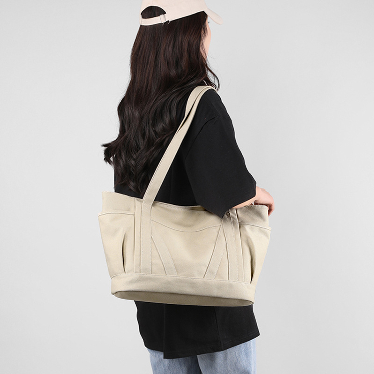 Explore the unique design features of large canvas tote bags with pocket, and how XINHUI offers customizable options