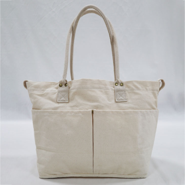 Explore the unique design features of corduroy tote bag with zipper, their versatile uses, and how XINHUI offers customizable options.