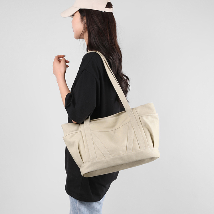Explore the unique design features of large canvas tote bags with pocket, and how XINHUI offers customizable options