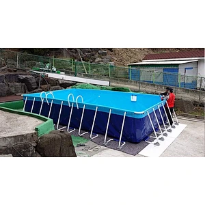 Rigid inflatable adult swimming pool with holders in the garden for sale