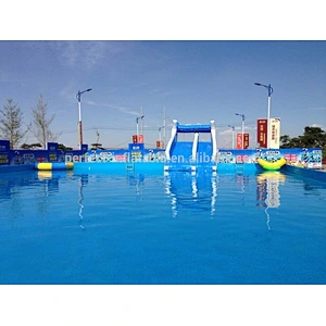 Large inflatable swimming pool with holders and a lovely dolphin slide