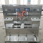 Semi-automatic stainless steel oil filling machine with heat sealer is ready to ship