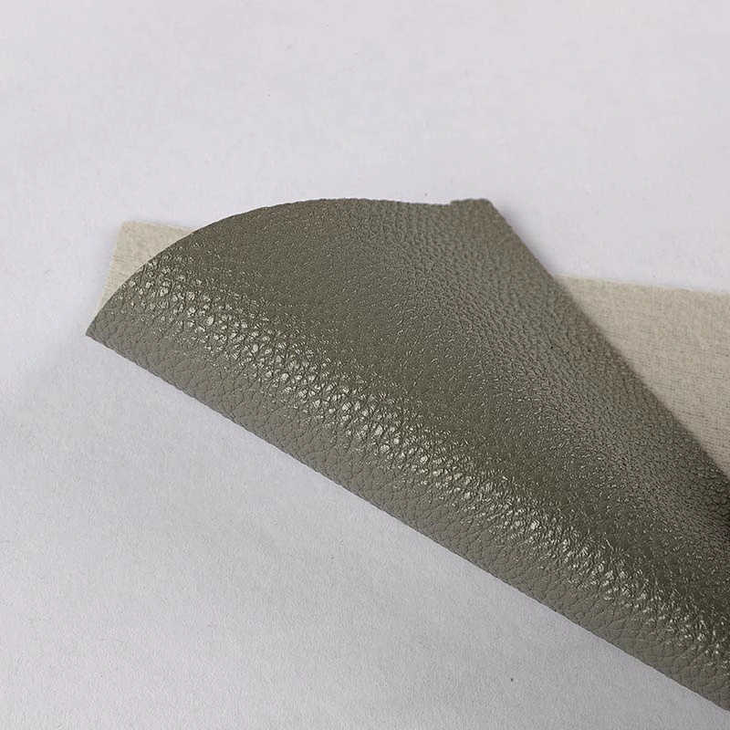 Embossed Litchi grain pvc leather for woman handbags with brush backing