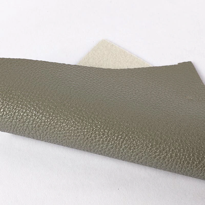 Embossed Litchi grain pvc leather for woman handbags with brush backing