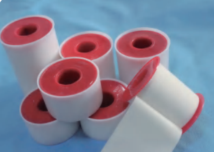 Zinc oxide plaster with plastic spool and cover