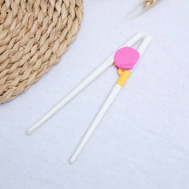 factory stock wholesale abs-resin chopstick holders for kids Children practice chopsticks intelligently  custom