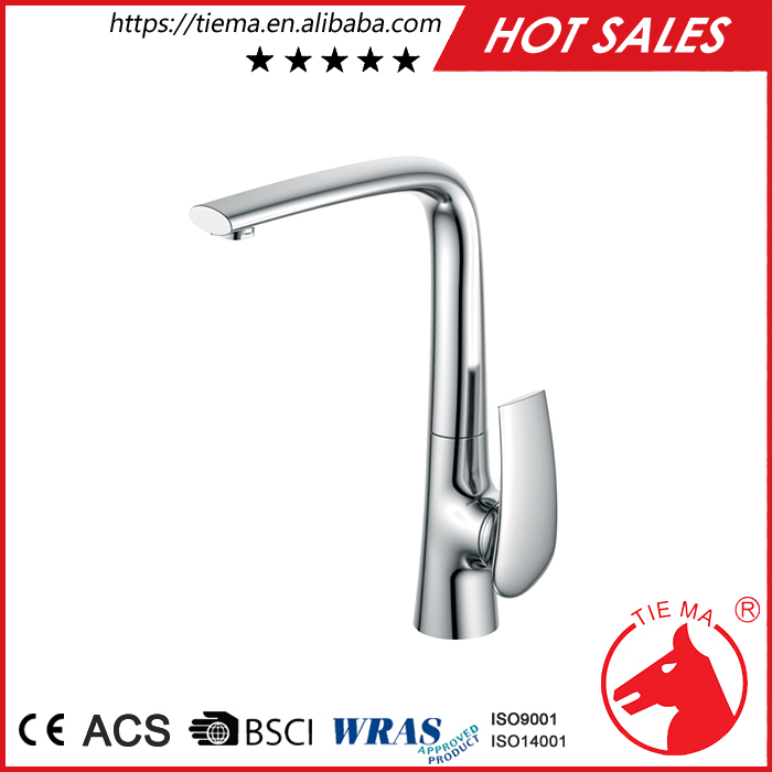 stainless steel sink with bronze faucet