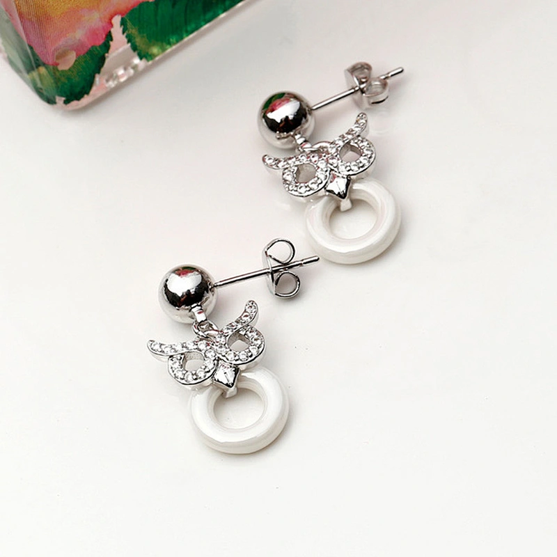 Miss Jewelry CZ micro paved Owl post black ceramic earrings