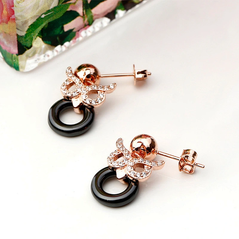Miss Jewelry CZ micro paved Owl post black ceramic earrings