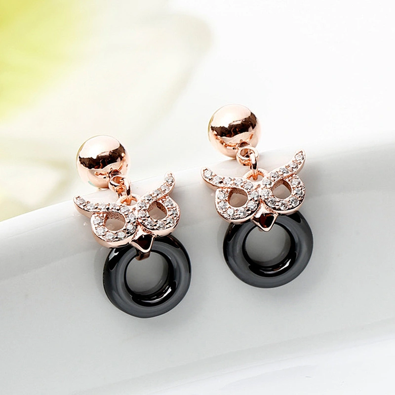 Miss Jewelry CZ micro paved Owl post black ceramic earrings