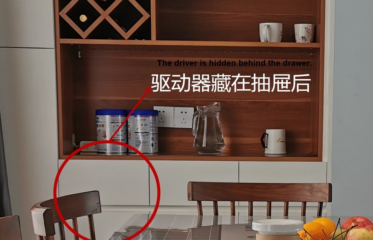 The cabinet has a drawer, and the driver is hidden behind the drawer
