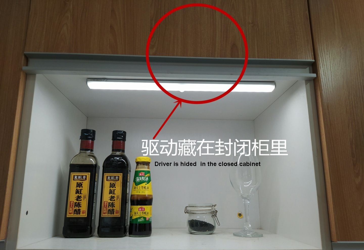 The driver is hidden in a cabinet with a cabinet door