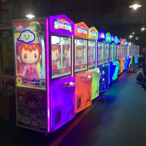 Arcade prize machines with colorful illuminated panels and edge lighting