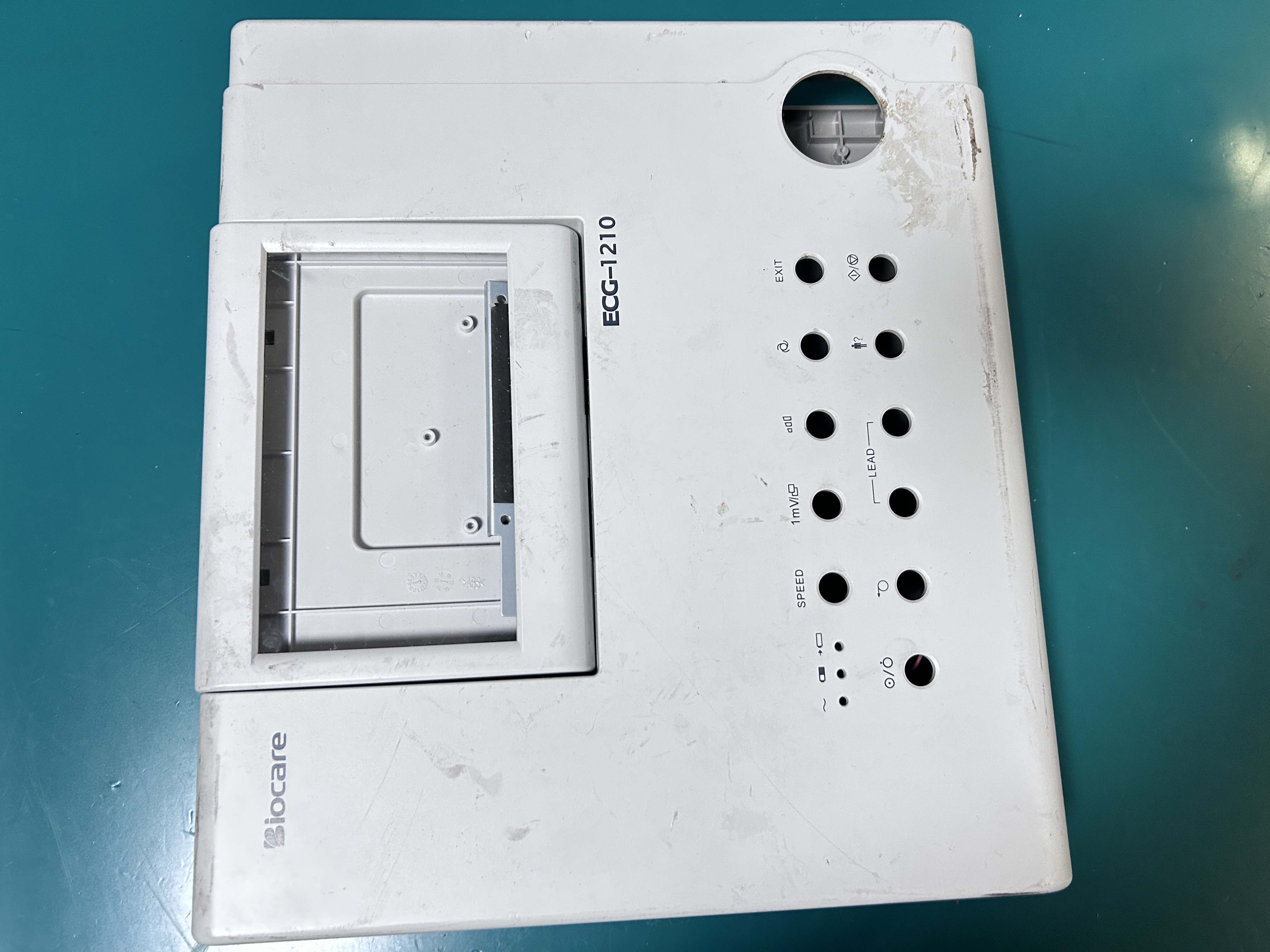 The complete Biocare ECG-1201 electrocardiograph set includes the display screen, printer, and motor assembly